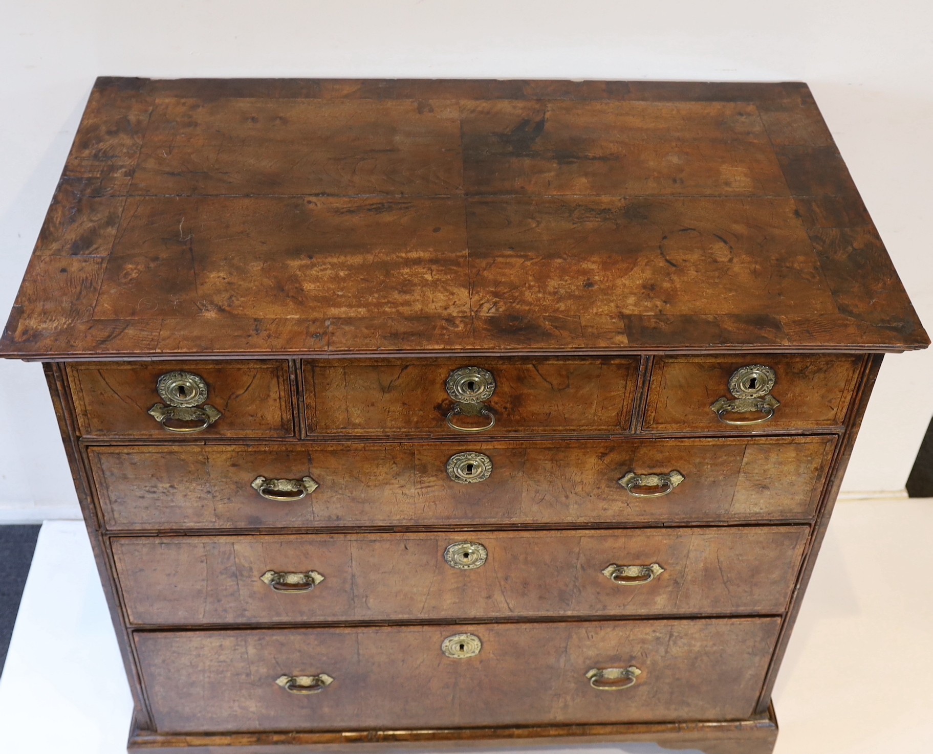 A George II crossbanded walnut chest, W.106cm D.59cm H.101cm